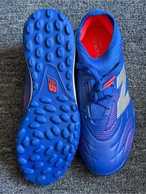 New Balance Blue Athletic Turf Soccer Shoes with Pink Accents